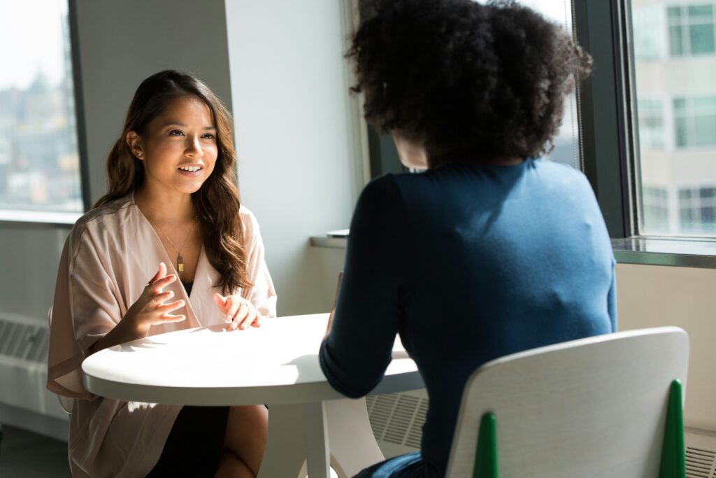 a women has an interview across the table from another women
