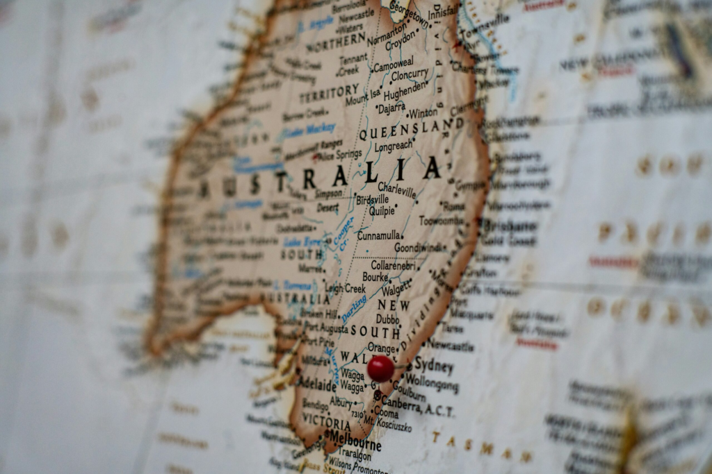 map of australia with a red push pin marking a city