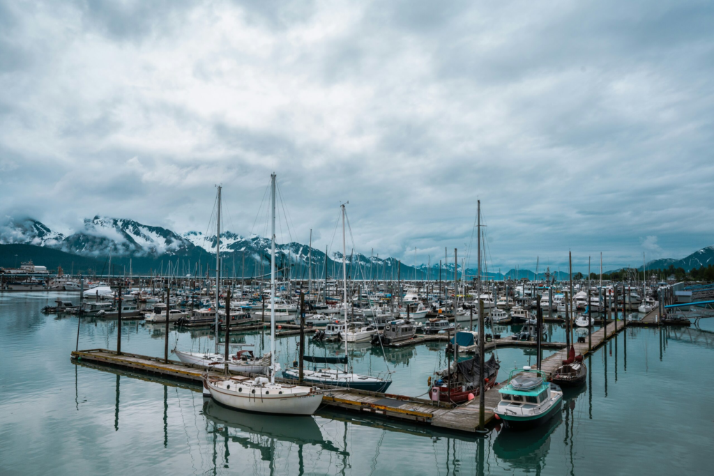 sail boats docked at port in Seward Alaska in the summertime