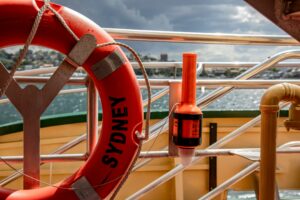 a life raft hanging on a ship sailing out to sea