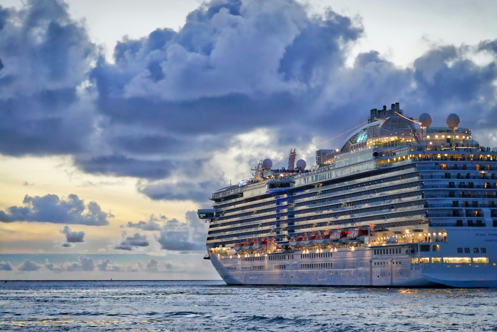 a cruise ship setting out to see as the sunsets