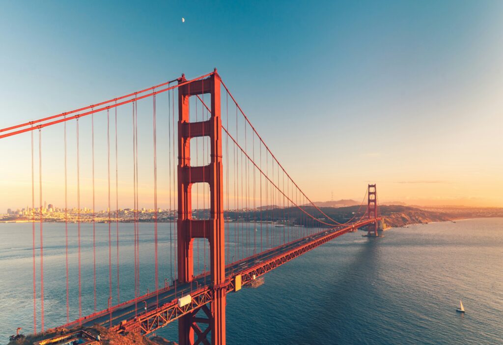 a view of the golden gate bridge in America at sunset
