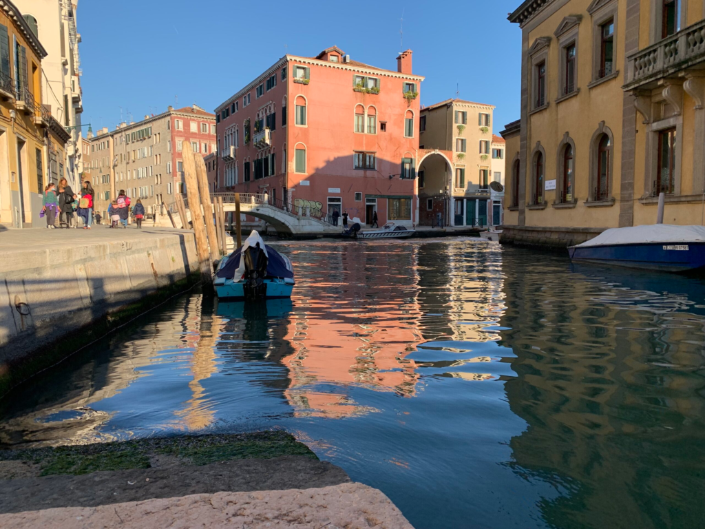 view of colorful buildings from a canal in venice italy