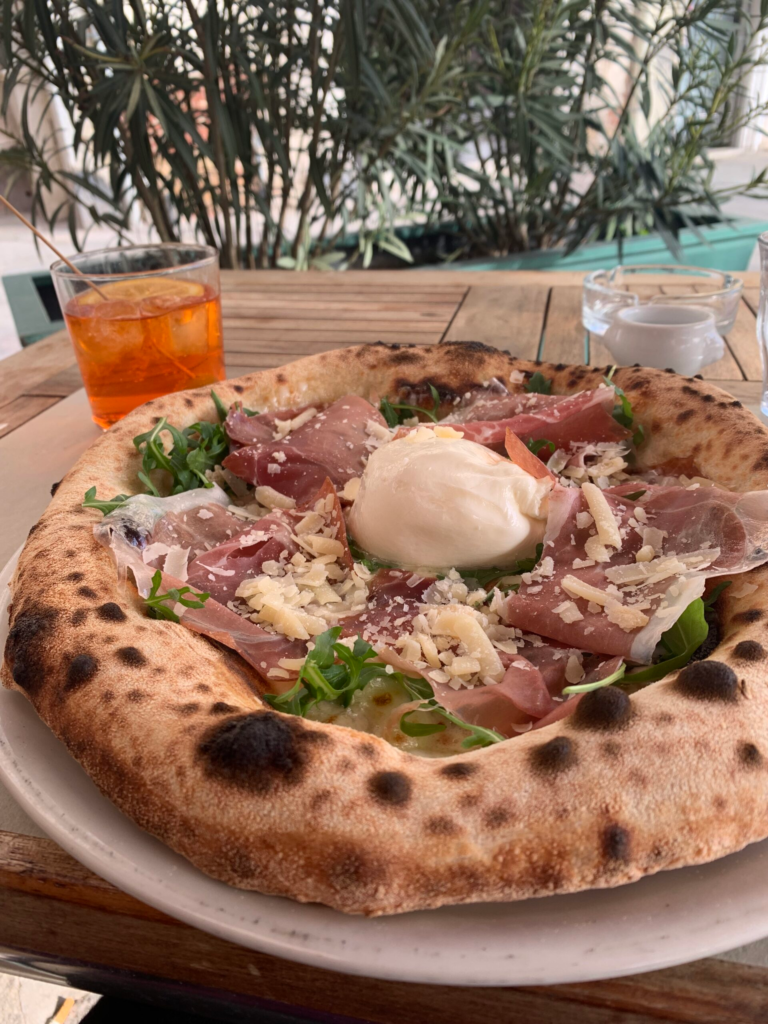 classic woodfire italian pizza with ricotta and prosciutto