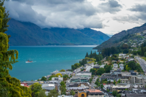 birds eye view of the city meeting the water in queenstown new zealand